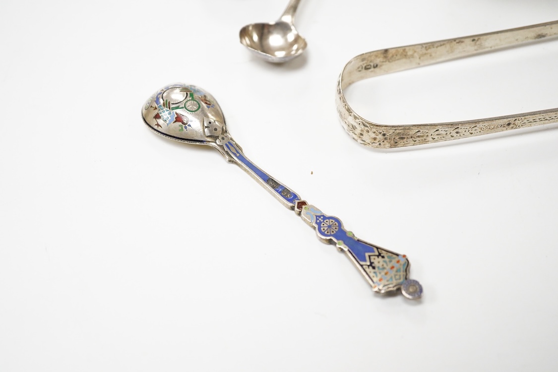 A George III silver pedestal salt, London, 1805, diameter 84mm, together with a pair of Georgian silver sugar tongs, two silver condiment spoons and a Russian 84 zolotnik and polychrome cloisonne enamel spoon, 11.1cm.